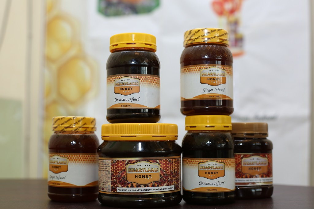 Artfully arranged jars of honey photographed for a product brand